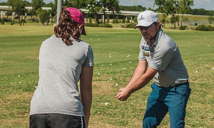 golf pro teaching golf student proper swing